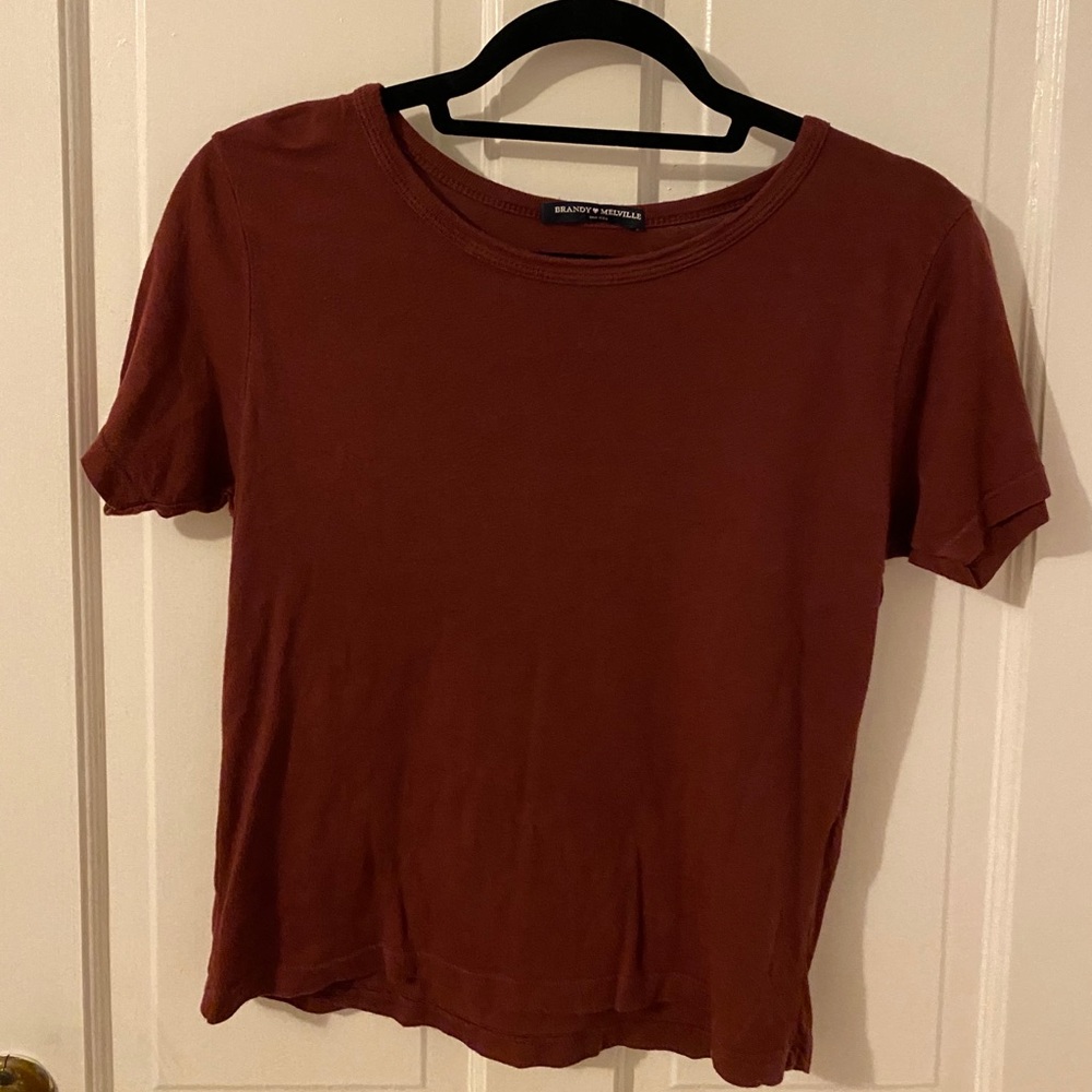 Maroon t-shirt.